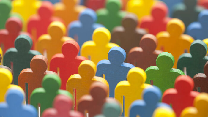 Wooden figures of people in different colours