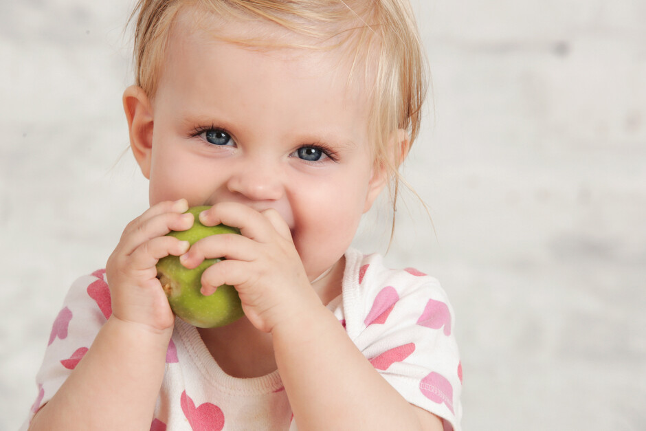 A child eating an apple.