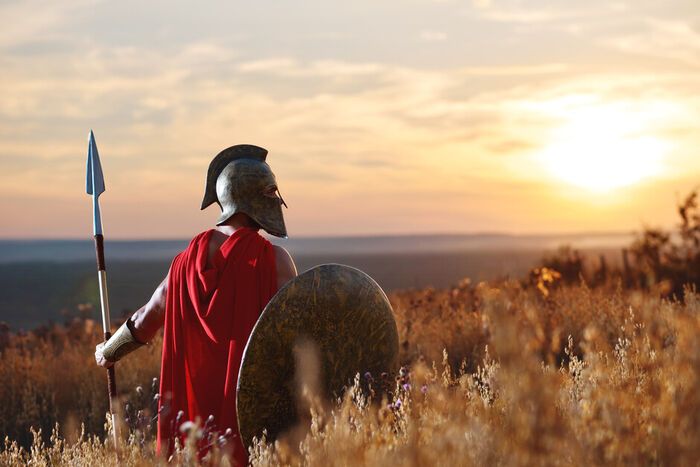 Romersk soldat i en kornåker ved solnedgang
