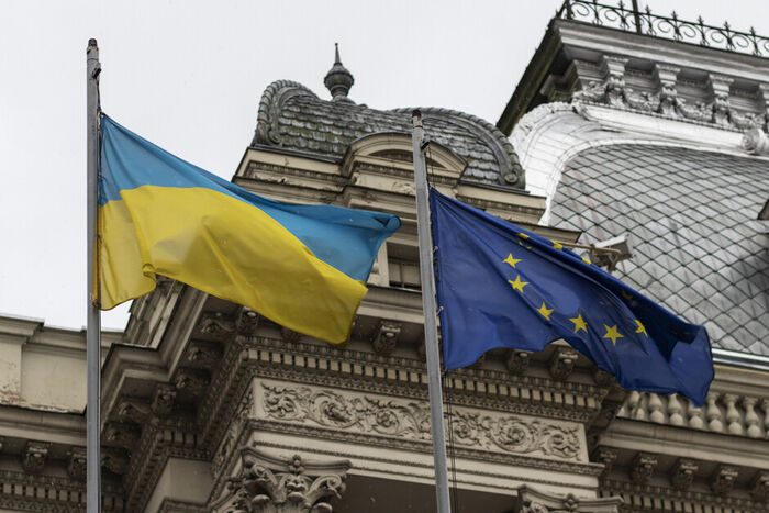Illustration photo of the Ukrainian flag and the EU flag