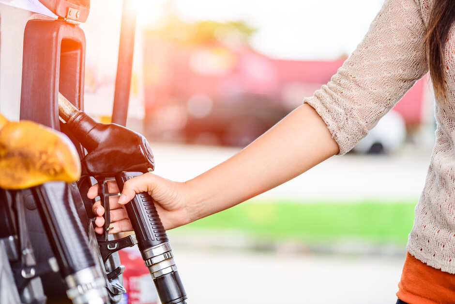 Illustration image of woman at a petrol station