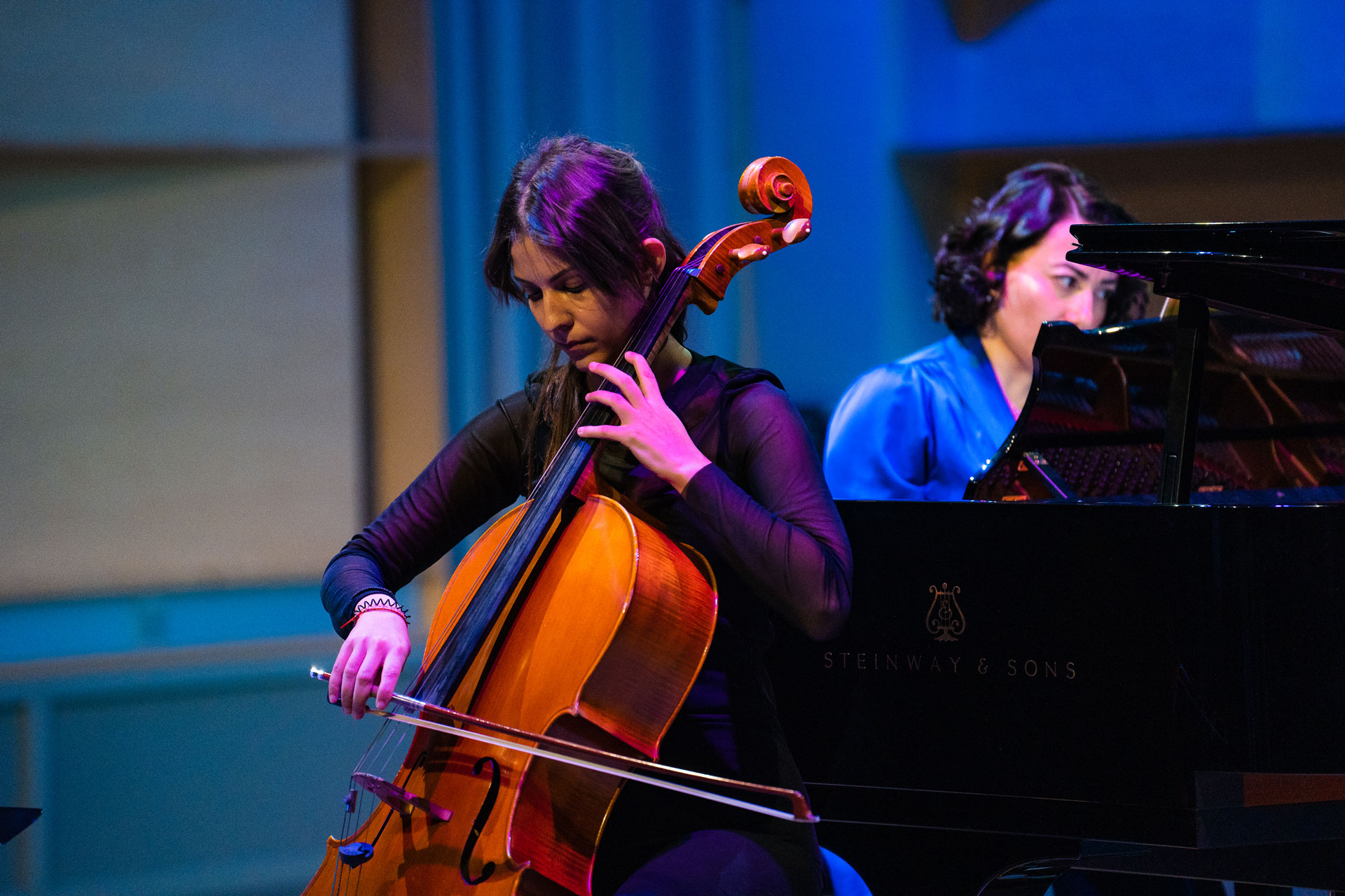Two women playing the cello and the grand paino (photo)